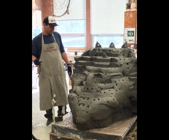 Man with his pottery sculpt