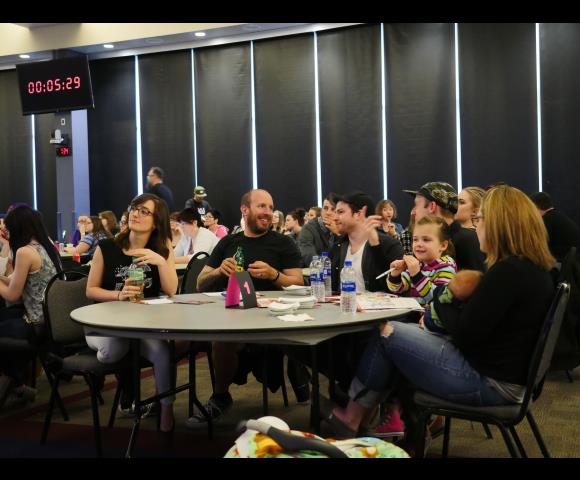 People sitting at table and collaborating with each other