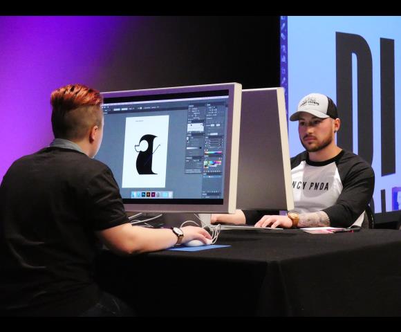 Men working on a graphic design