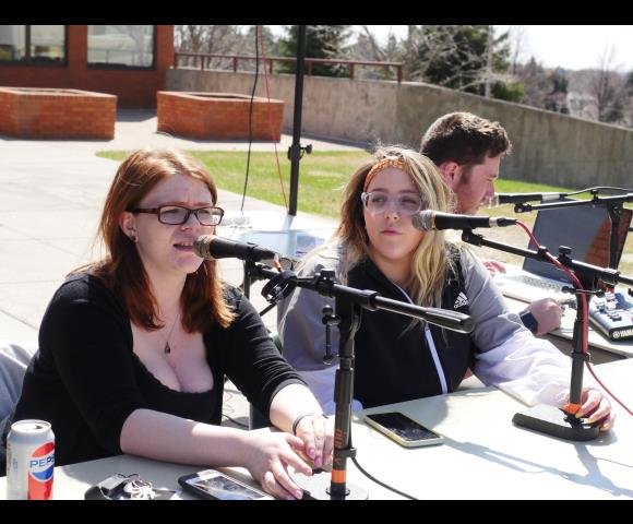 Women speaking into the microphone