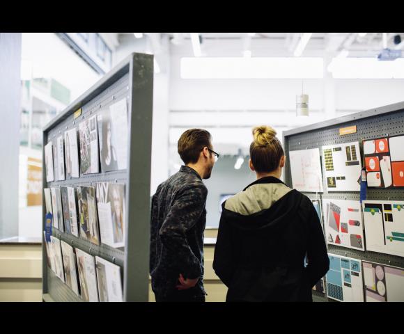 People looking at Art wall
