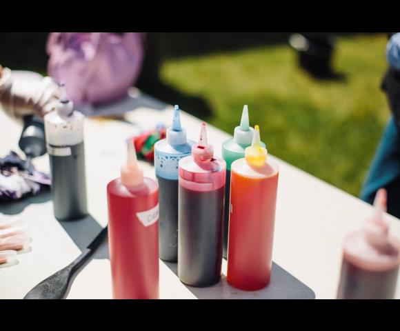 Bottles with purple, pink, blue paint
