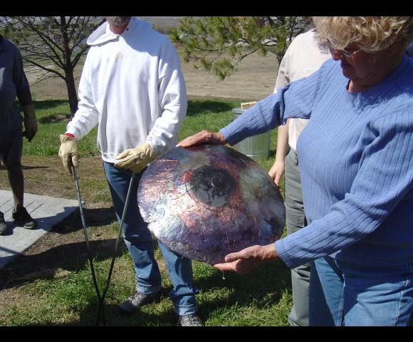 holding Raku-Fired Pottery