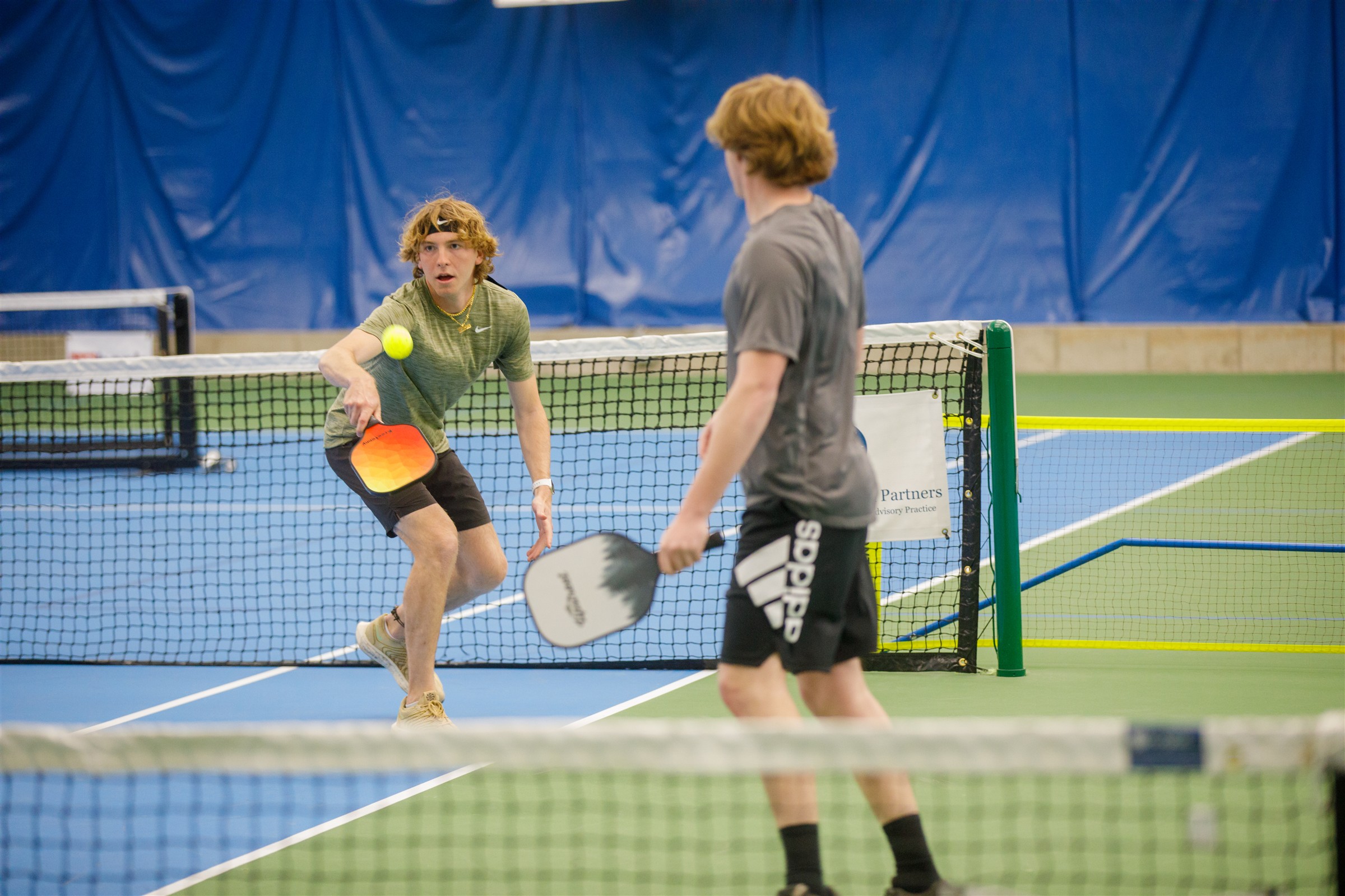 students playing tennis